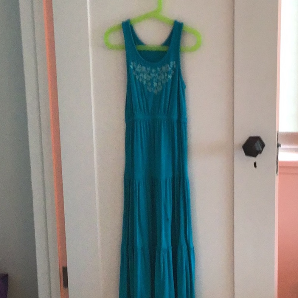 Blue tank top dress with white flowers.